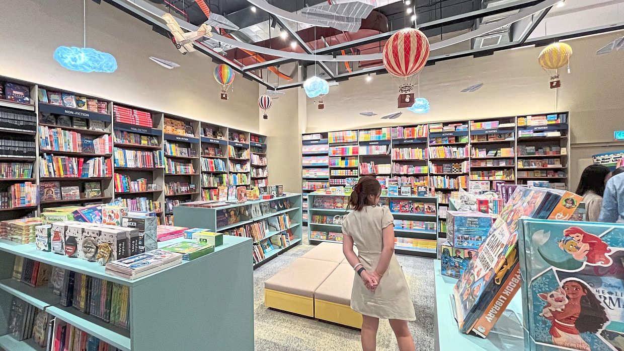 The new bookstore also encourages families to explore and read with a colourful children's section. Photo: The Star/M. Irsyad