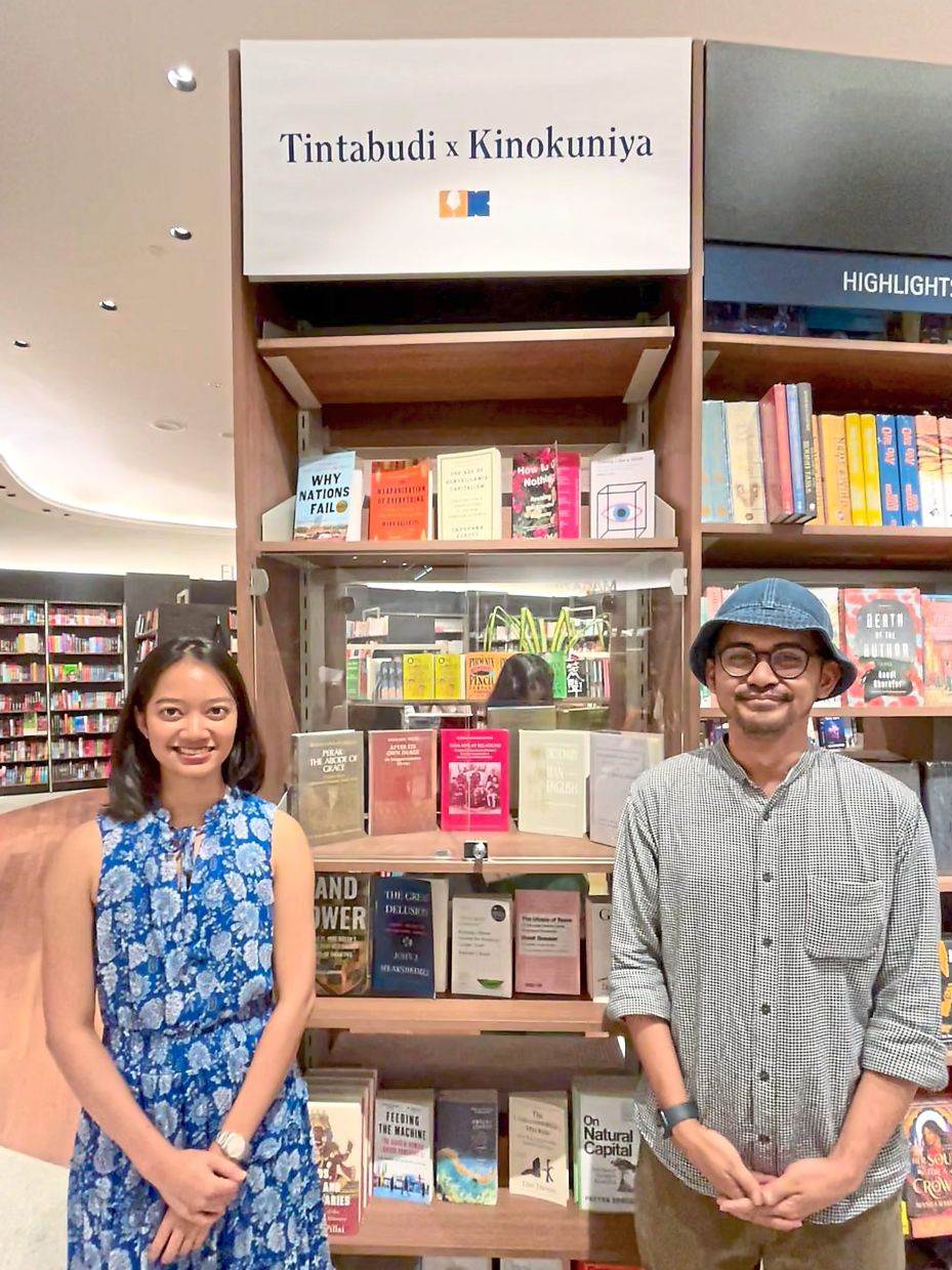 Tintabudi’s Ainil (left) and Nazir carry their indie bookstore’s fiercely curated shelves into Kinokuniya’s brand-new Pavilion Damansara Heights outlet. Photo: The Star/M. Irsyad