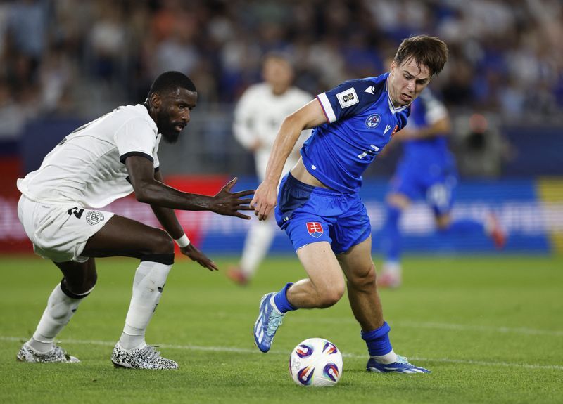 Soccer-Germany suffer shock 2-0 loss at Slovakia for first ever World Cup qualifying away match defeat