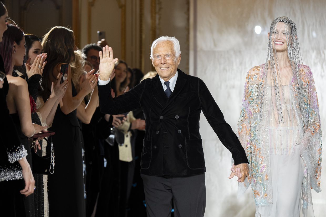 Giorgio Armani waves at the end of the Spring/Summer 2025 Giorgio Armani Couture collection in Paris. Photo: AP
