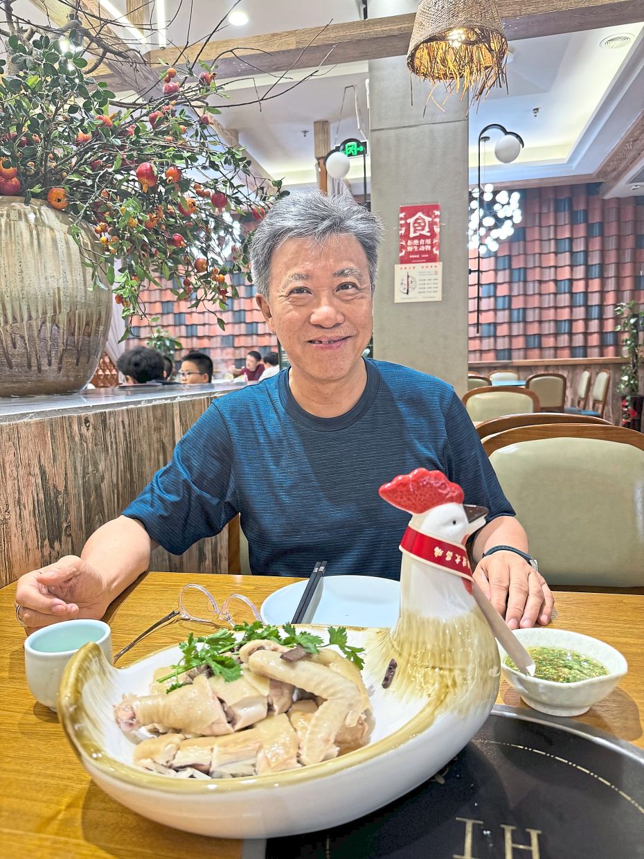 One simply has to try the chicken rice in Hainan as that's where it originated, but the writer still prefers Malaysian chicken rice.