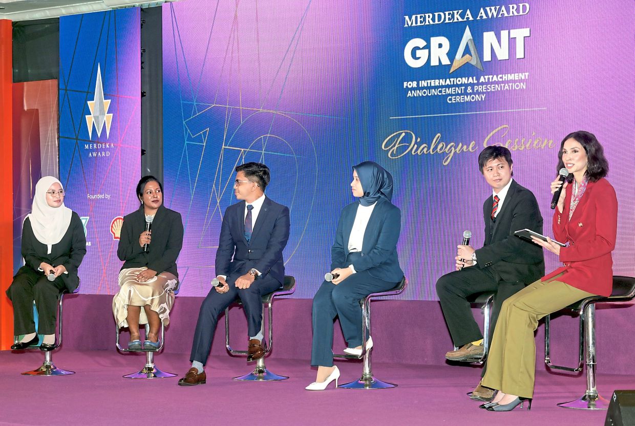 Vernacular beginnings: Keisheni (second from left) and Calvin (right) with the other recipients of the 2025 Merdeka Award Grant for International Attachment. With ambassadors like them, it looks like vernacular schools are here to stay. — SAMUEL ONG/The Star