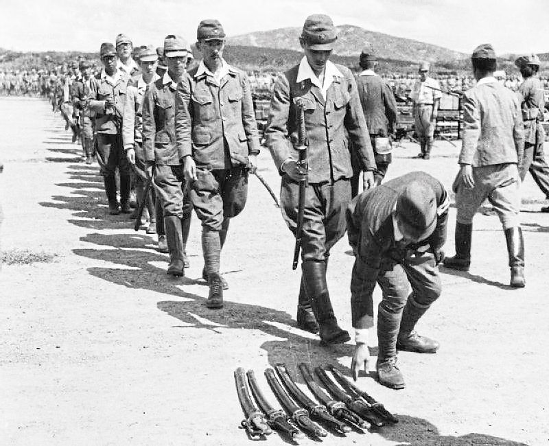 The Imperial Army of Japan laying down their arms to mark their surrender in Kuala Lumpur. — UK National Archives