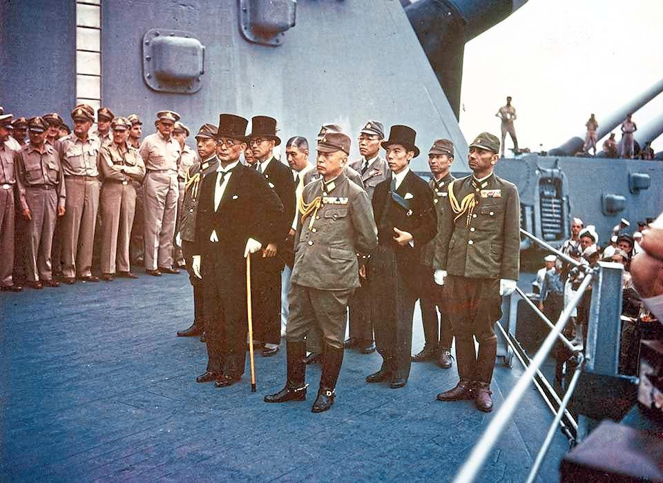 Historic day: Representatives of the Japanese Empire (top and below) on board the USS Missouri in Tokyo Bay on Sept 2, 1945, to sign the Instrument of Surrender, which formally ended World War II. — US Naval Historical Center/AP