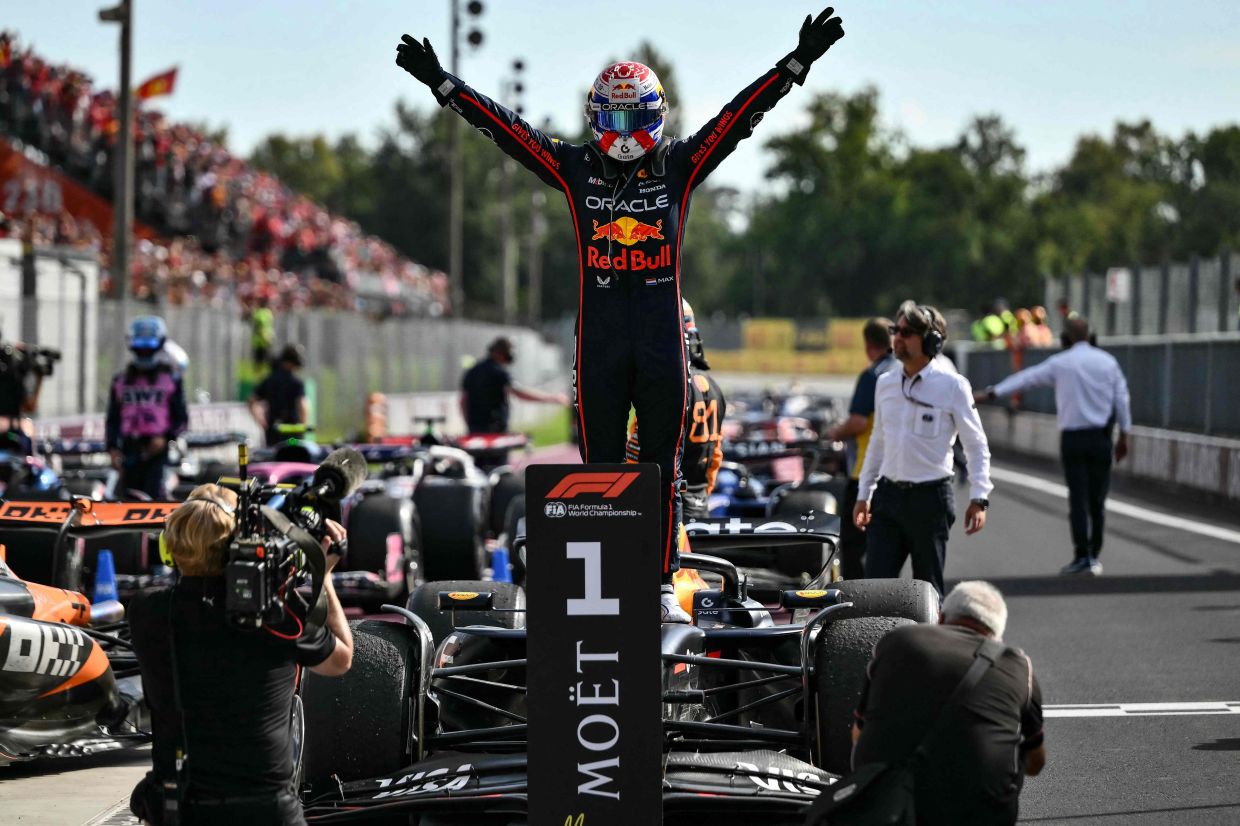 Red Bull Racing's Dutch driver Max Verstappen celebrates after winning the Italian Formula One Grand Prix at the Autodromo Nazionale Monza circuit, in Monza, northern Italy, on Sunday, September 7, 2025. -- Photo by Marco BERTORELLO / AFP