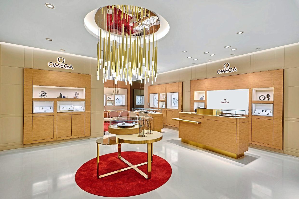 The interior of natural wood has touches of red and gold. 