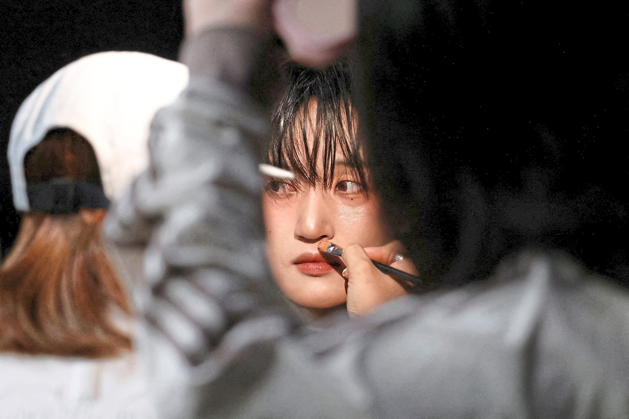 Camera-ready: Seok being made up to film a scene for the group’s new music video in Seoul. — Reuters