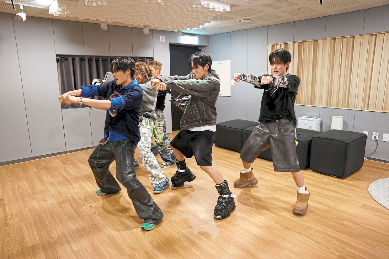 It’s showtime: 1VERSE performing their new single in front of a camera in Seoul. — Reuters