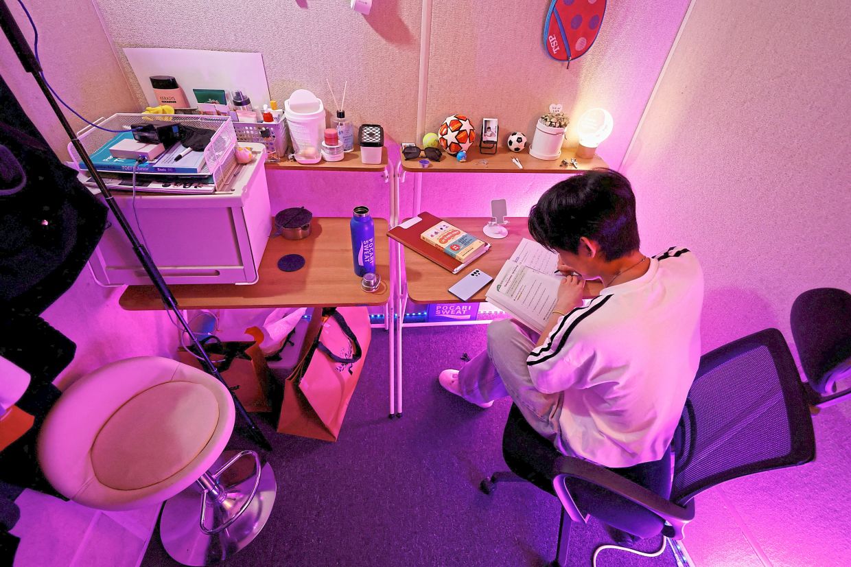 Seok studying English in his room in Seoul. — Reuters