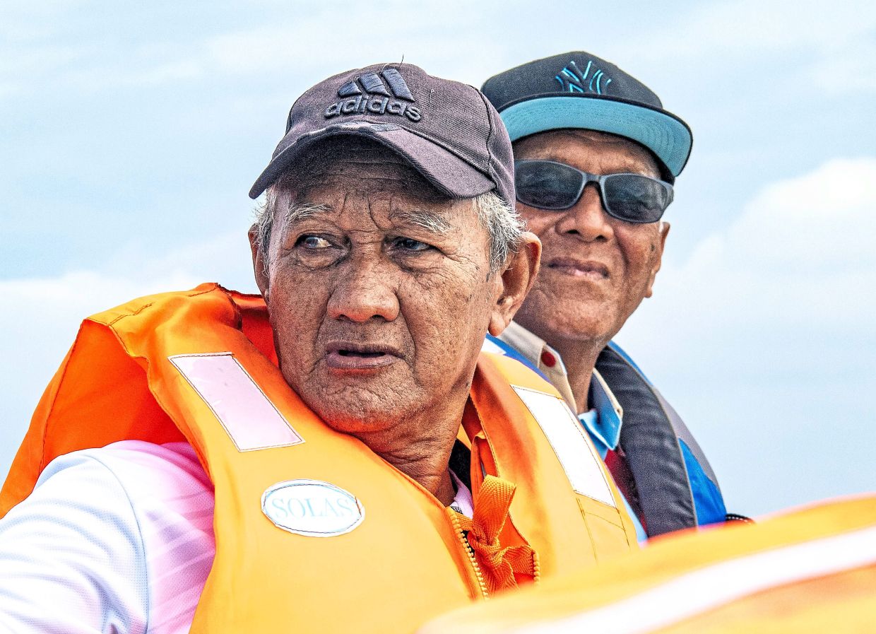 Kamarzaman (right) urges authorities to provide an emergency boat and better medical facilities for the island.