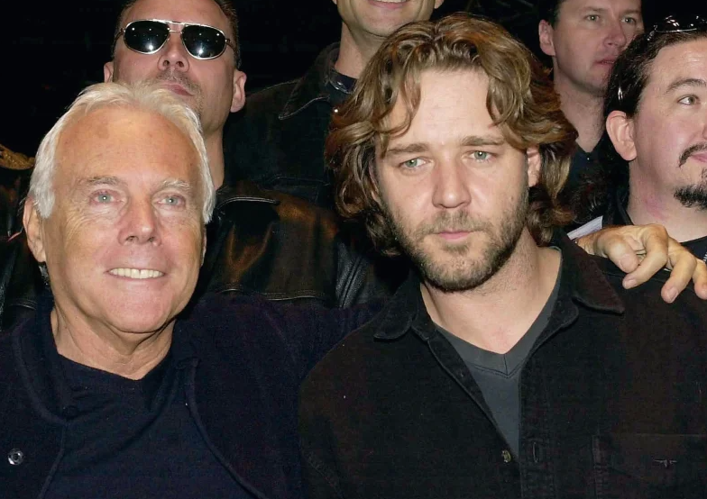 Russell Crowe (right) meets Giorgio Armani prior to a benefit concert for Children In Crisis Italy with his Australian folk/rock band Tofog, in Milan, Italy, Feb 26, 2001. Photo: AP
