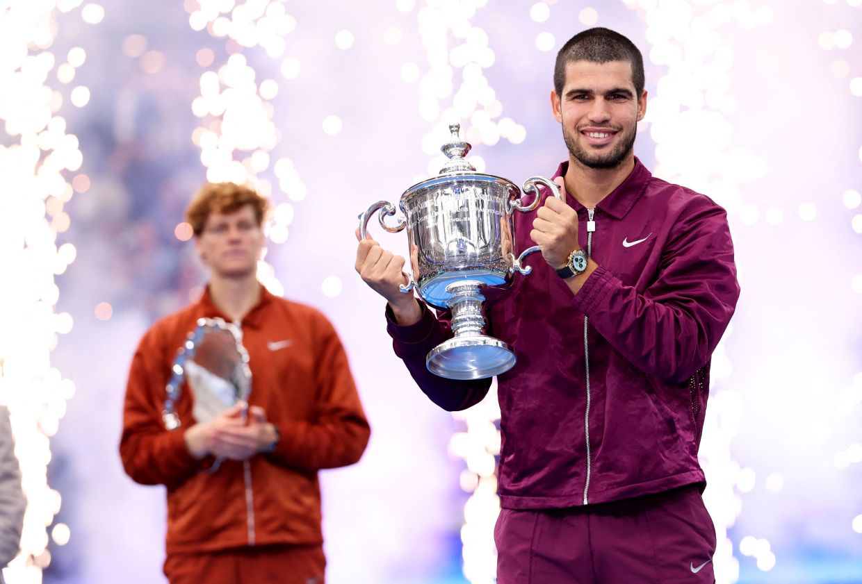 NEW YORK: Carlos Alcaraz of Spain poses with his trophy after defeating Jannik Sinner of Italy during their Men's Singles Final match on Day Fifteen of the 2025 US Open at USTA Billie Jean King National Tennis Center in New York City.-- Photo: Clive Brunskill/Getty Images/AFP