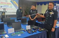 Melaka cops bust two online fraud syndicates, 19 arrested
