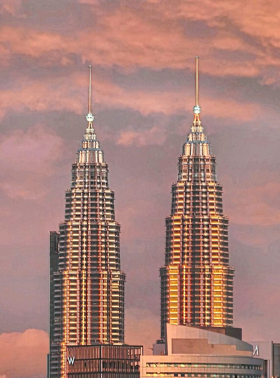 Skyscrapers kissed by fire, a golden reflection caught without a DSLR.