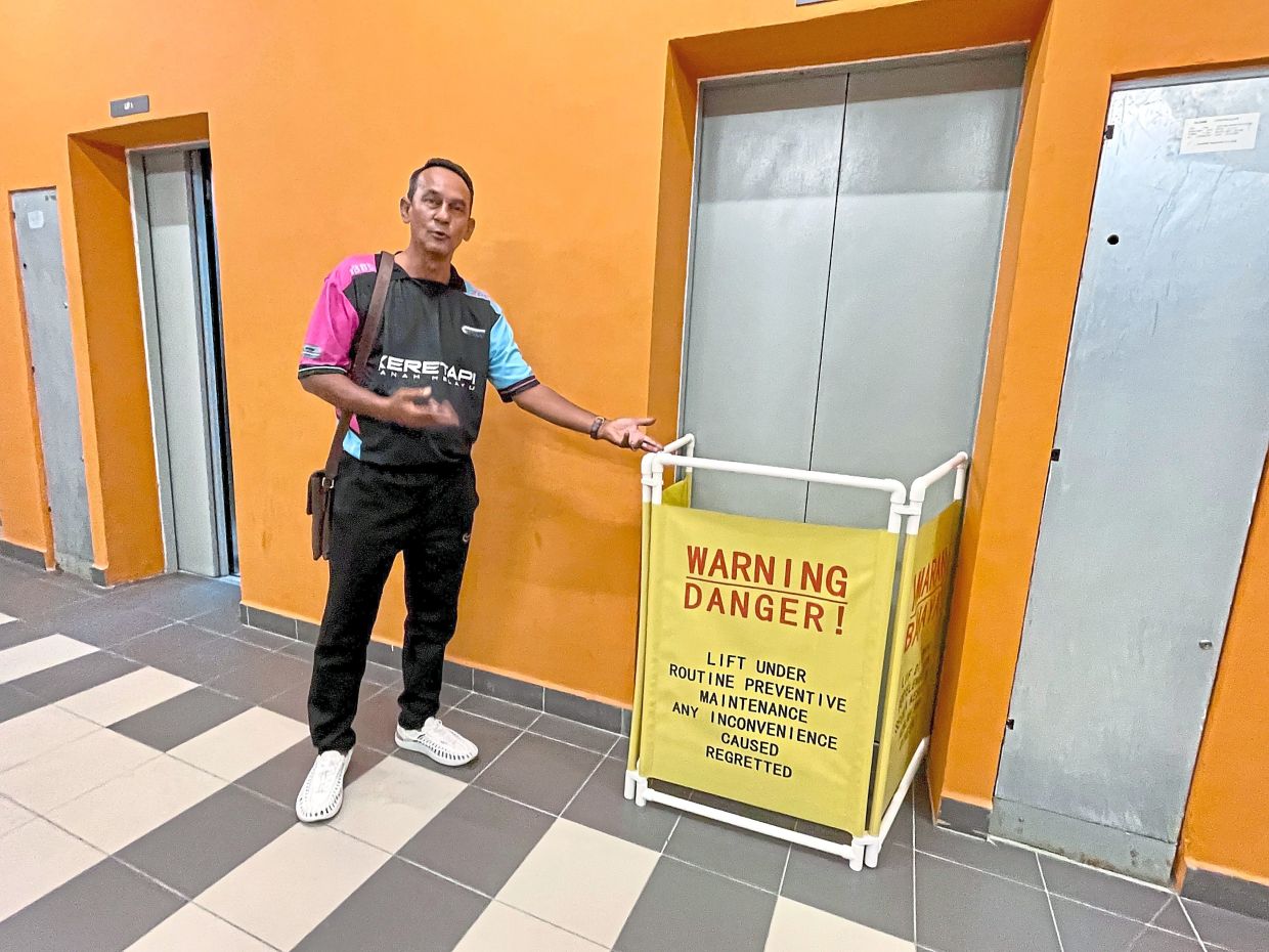 Mohd Ramdzan showing one of the lifts that has been out of order.
