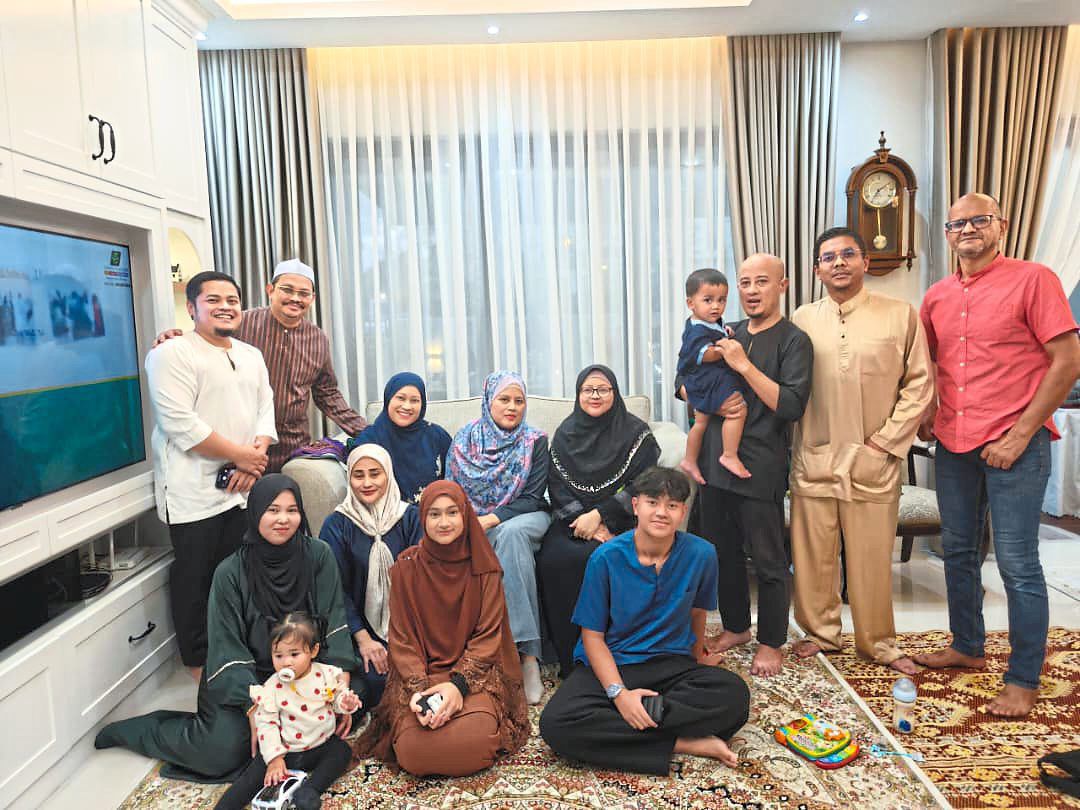 A family built on strength: Rita (seated, in black) with her loved ones, from whom she not only received strong support but also invaluable lessons on resilience and growth. — RITA HATTA