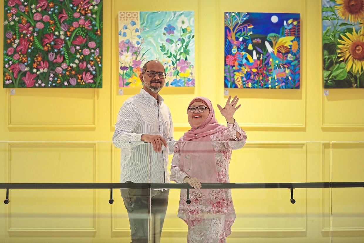 A strong support system: Rita and her husband, Mohamed Hussein Mohamed Ahmed, 55, who is also her business partner, at one of their exhibitions.
