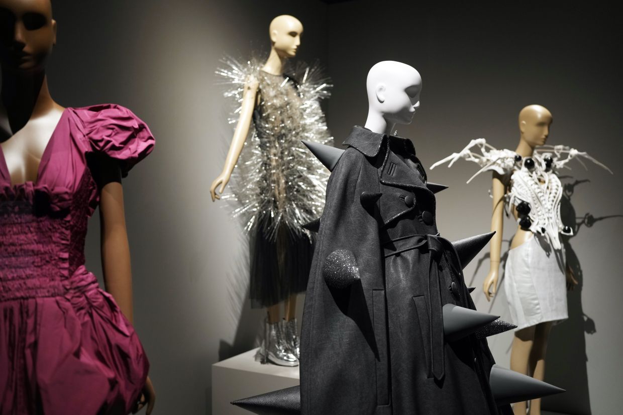 Various fashion designs are displayed during a press preview for the exhibit 'Dress, Dreams And Desire: Fashion And Psychoanalysis'. Photo: AP