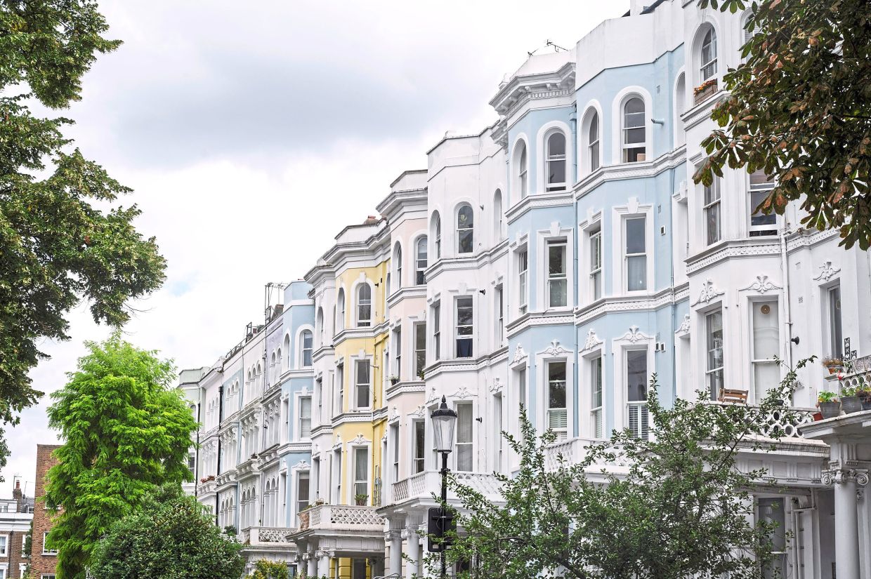 Housing from the Georgian era around the Portobello Road area of Kensington, in London. Built for a cooler climate, many homes need to be retrofitted for warming temperatures, but It won’t be as simple as installing air-conditioning. — Mary Turner/The New York Times