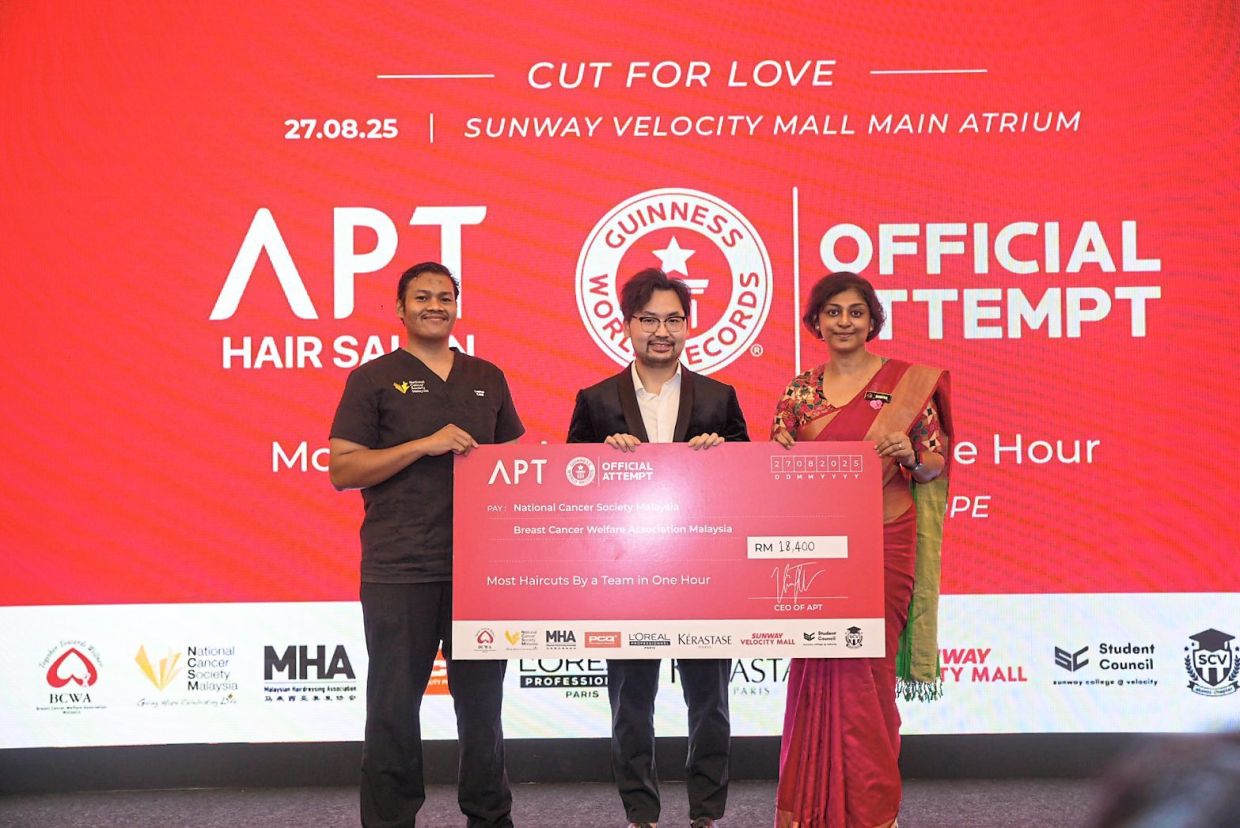 (From left) NCSM senior executive Muhammad Luqman Syafiq, APT Hair Salon CEO Vincent Teh and BCWA assistant general manager Sumitra Selvaraj during the mock cheque presentation.
