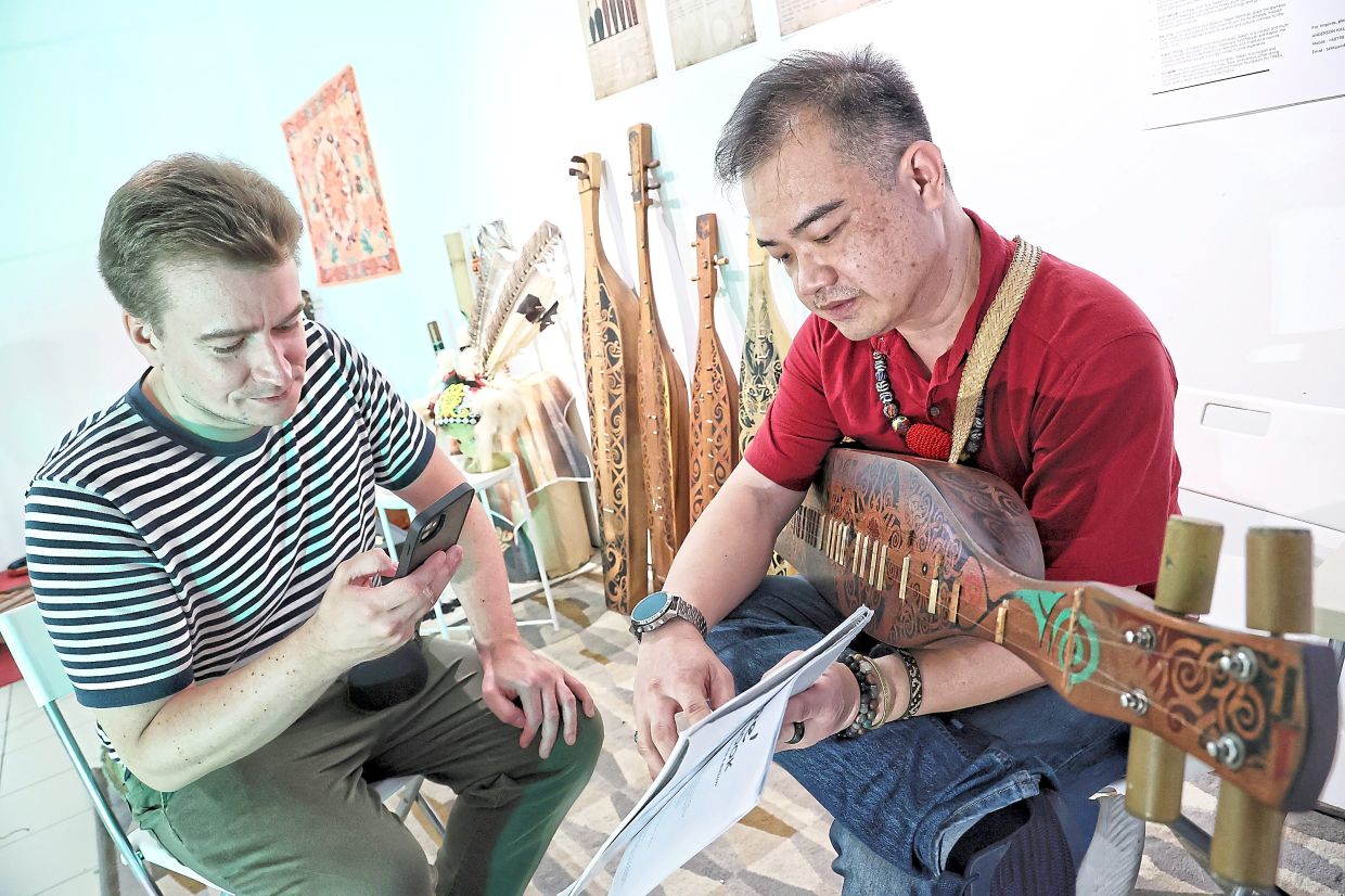 Kalang (right) conducting a recent sape workshop session at the exhibition. He is set for another busy weekend at the 'Rentak Malaysiaku' event on Sept 13 and 14 at GMBB in KL. Photo: The Star/Muhamad Shahril Rosli