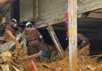 Firemen recover Penampang landslide victim's body