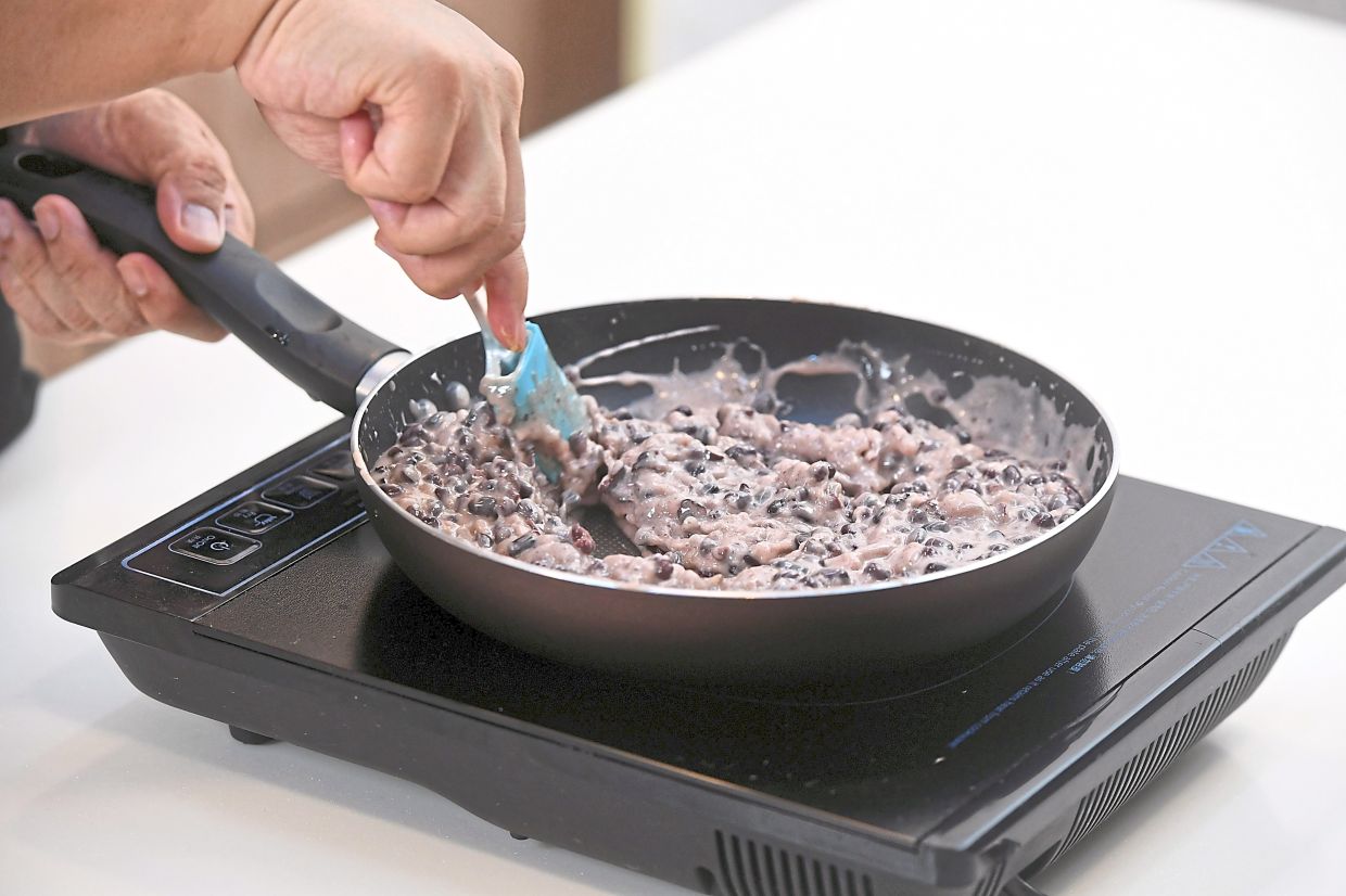 For the red layer, boil red beans, combine the boiling liquid with the batter ingredients and simmer over low heat until thickened.