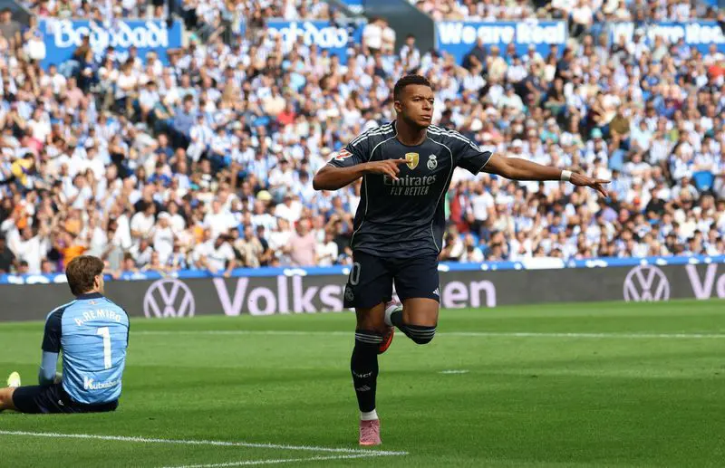 Football: Soccer-Mbappe shines as 10-Man Real Madrid hold on for 2
