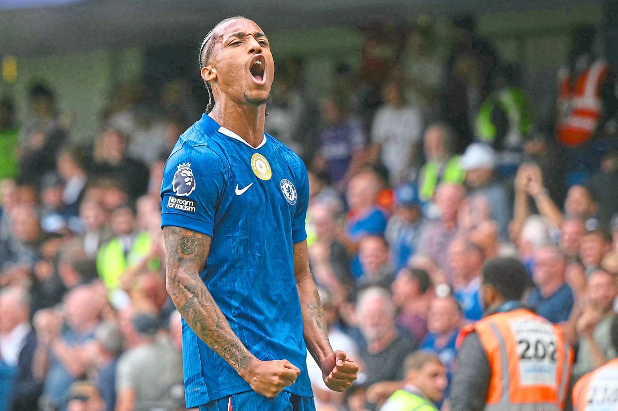 Chelsea's Brazilian striker Joao Pedro celebrates after scoring the opening goal during the EPL football match between Chelsea and Fulham at Stamford Bridge in London on Aug 30. — AFP