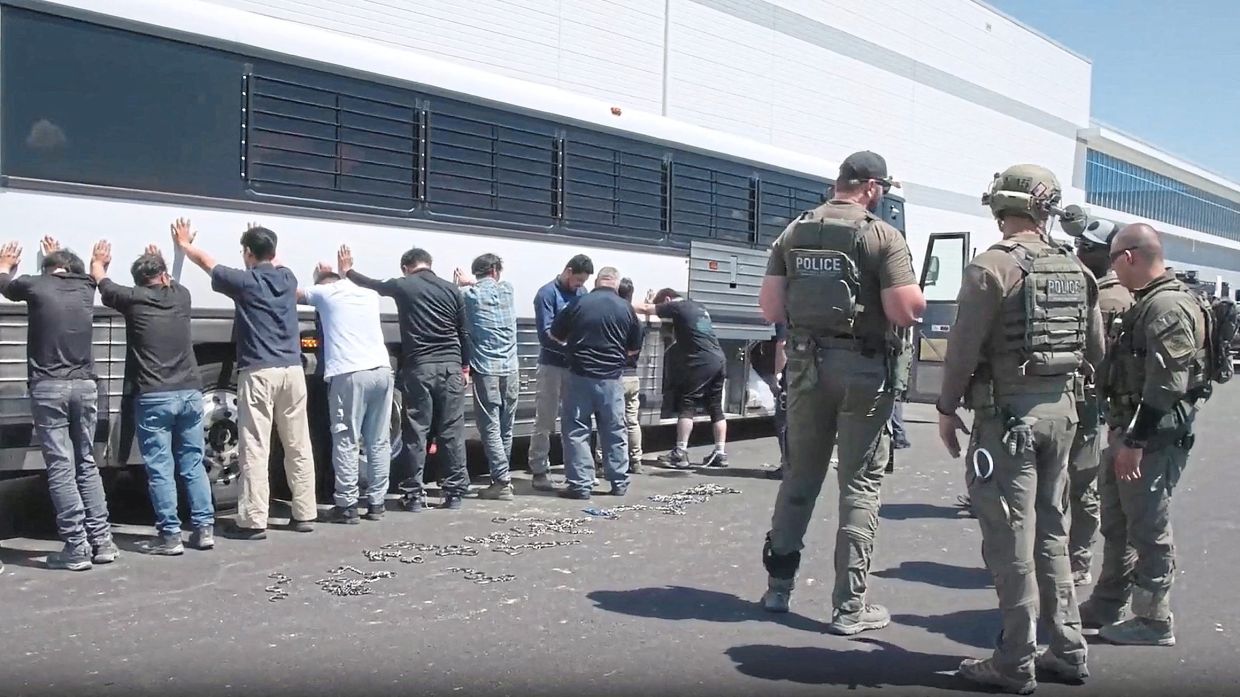 ICE federal agents executing an enforcement operation at the Hyundai-LG EV battery plant in Ellabell, Georgia. — ICE/AFP