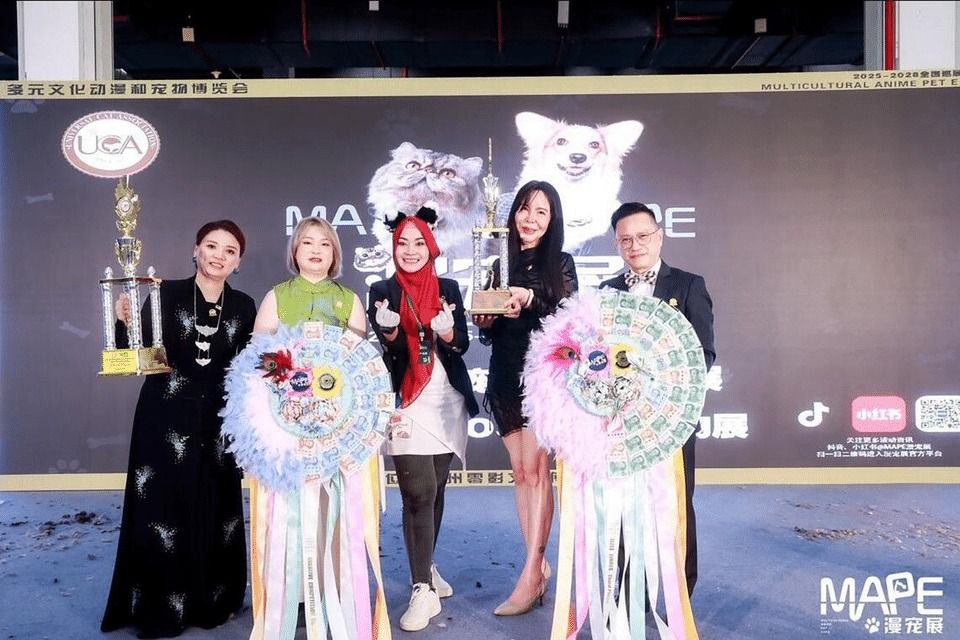 Cat groomer Aziemah Zakiyyah Azmi (centre) was placed third in two categories at the Universal Cat Association Cat Groomer Elite Competition. -- PHOTO: COURTESY OF AZIEMAH ZAKIYYAH AZMI