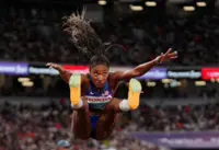 Athletics-Davis-Woodhall adds world long jump title to Olympic crown