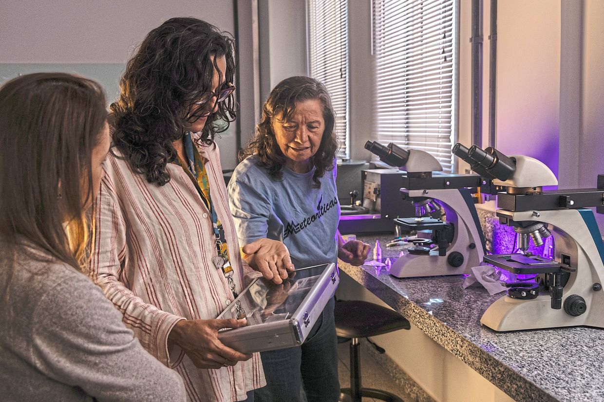 Rocha (centre) and Zucolotto (right), both geologists and members of As Meteoriticas, anall-female team of scientists devoted to preserving and expanding Brazil's meteorite collection, at the geology laboratory at the Federal Universityof Goias in Goiania. — Dado Galdieri/The New York Times