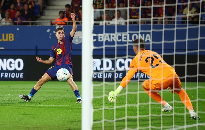 Soccer-Barcelona demolish Valencia 6-0 in front of small crowd