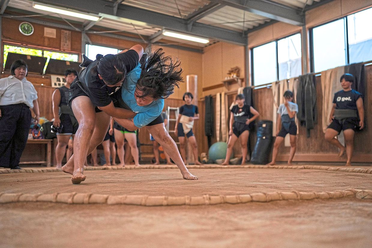 Wrestlers train during a practice session at the camp. Photo: AP