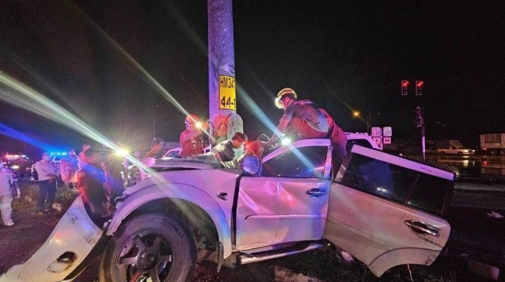 The driver’s white SUV was almost cut in half by the sheer impact of the crash. Rescue crews had to use high-powered hydraulic cutting tools to free the boyfriend from the wreckage. -- Photo: Handout / SCMP