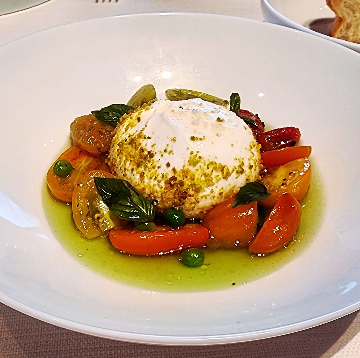 The burrata is creamy and cloud-like and this decadence is offset by the tanginess of the tomatoes in this amalgamation.