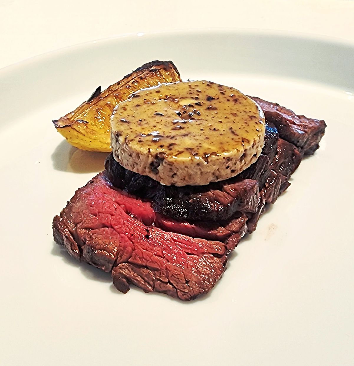 The hanger steak is tender and succulent while the green pepper butter is a temptress in its own right.