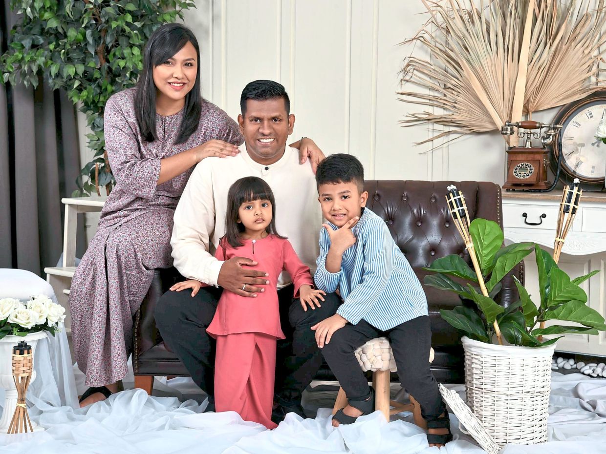 Muhammad Syafik and Salina with their two children Muhammad Danish and Dhiya Sophea. 