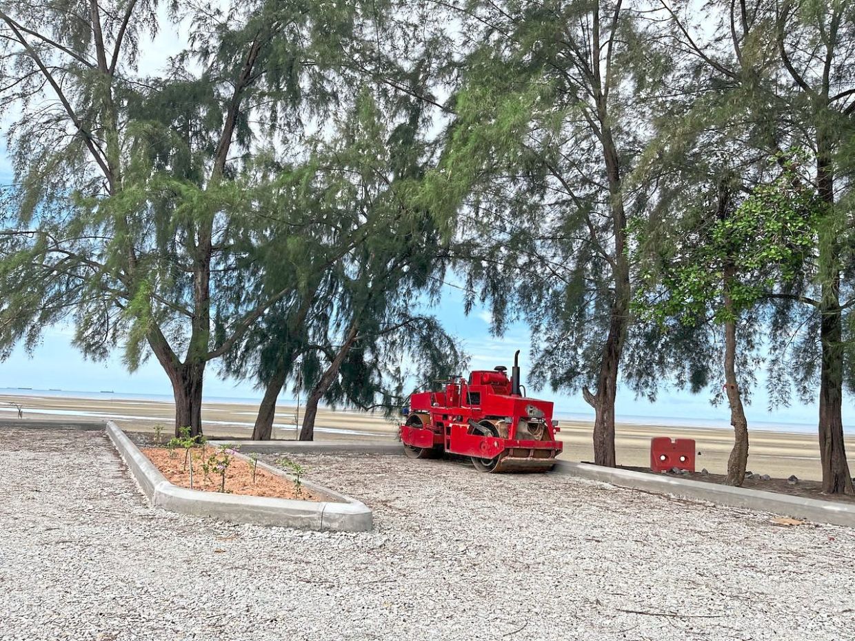 Gravel being laid on the caravan park in Pantai Bagan Lalang in preparation for its launch. 