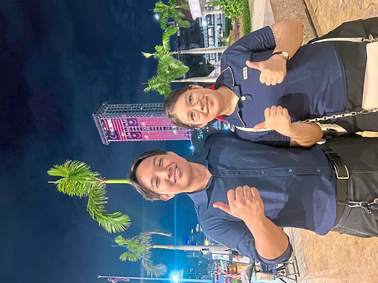 Gideon and Ruth revel in the buzz at Dataran Merdeka – basking in city lights, laughter and time together. — ADANI ZAIDI/The Star