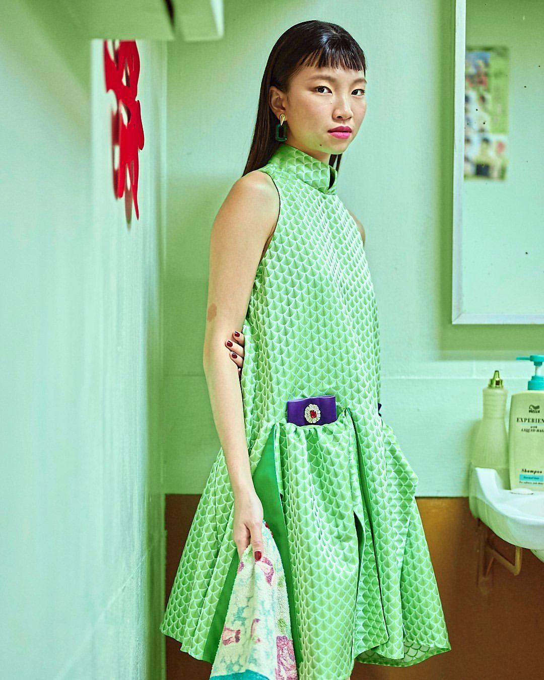 Lau reimagines the cheongsam with a modern touch – an elegant look suited to any occasion. — Wynka 