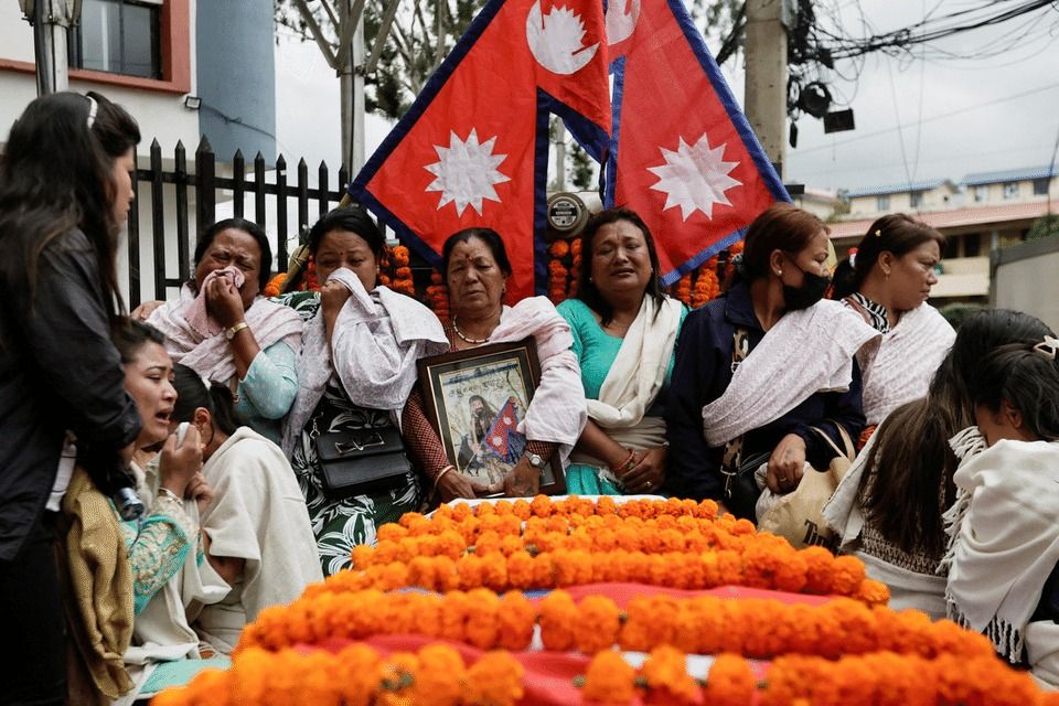 Family members of Binod Maharjan, who died in last week's anti-corruption protests that toppled the government, mourn next to the coffin carrying his body in Kathmandu, Nepal, Sept 16, 2025. - Reuters