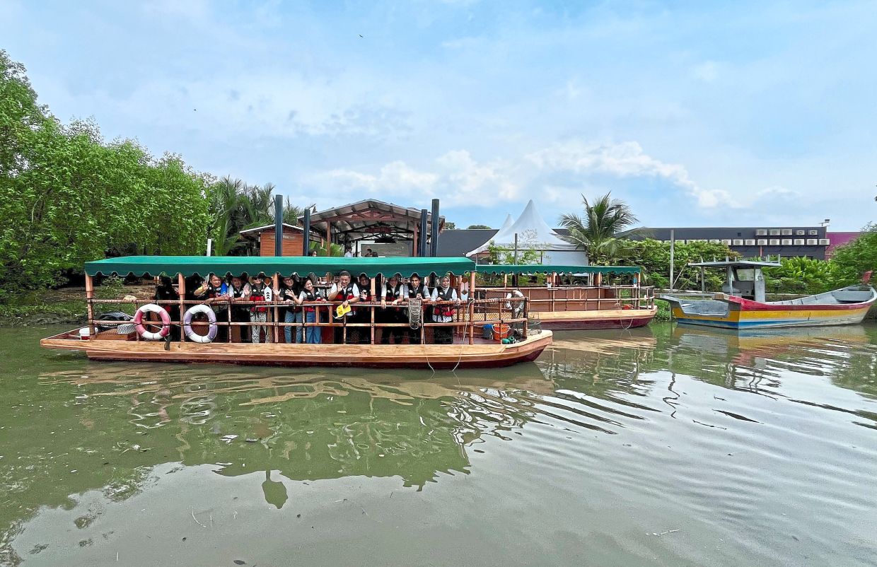 Wong and guests setting off for a ride during the launch of Penang River Cruise at Juru Auto City in Seberang Perai.
