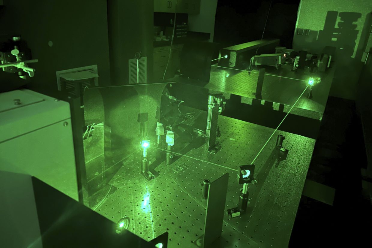 In this photo provided by researchers, lasers are used to determine a chemical fingerprint of samples of the blue paint from the Jackson Pollock painting 'Number 1A, 1948' in Stanford, Calif., on Jan. 30, 2023. — Photo: Alexander Heyer, via AP