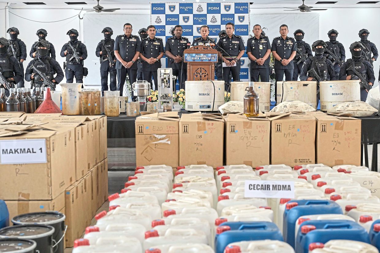 Successful raid: Mohd Khalid (centre) showing the massive drug haul to reporters. — Bernama