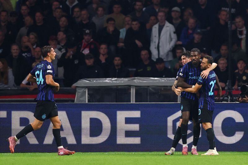 Soccer-Thuram grabs double as Inter ease past hosts Ajax