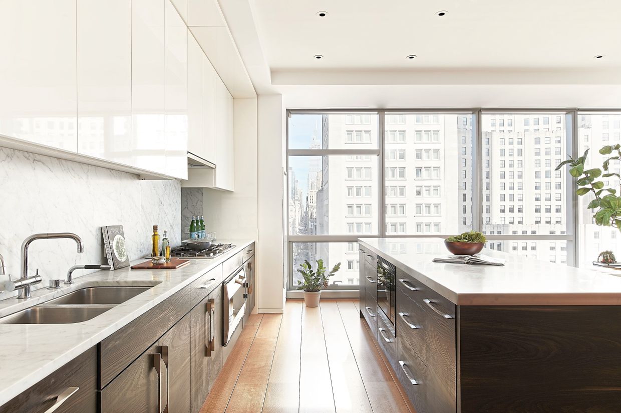 Off-white quartz countertops help to create a neutral kitchen that is also functional.