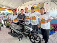 Revelling in muddy fun at paddy field carnival