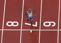 Athletics-Lyles blasts into 200m final with 19.51 seconds